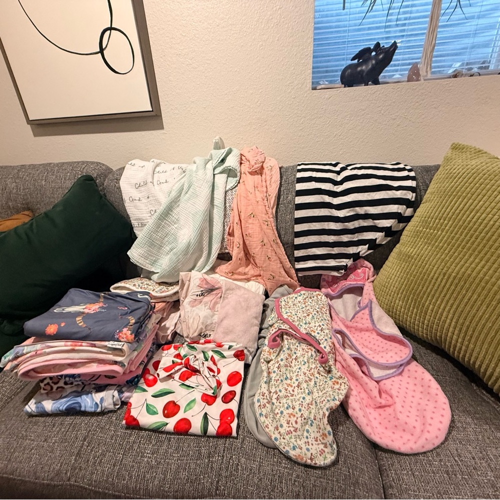 Bundle of baby swaddling and receiving blankets